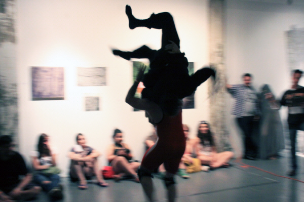 Performance Documentation (photograph) of 0H10M1KE and TJ in Brooklyn Fireproof Gallery, Brooklyn NY. 